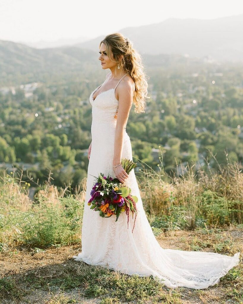 bride wearing a sheath wedding dress overlooking the suburbs of Los Angeles