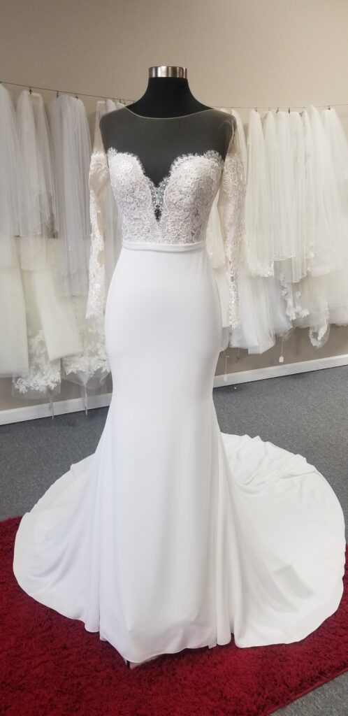 long-sleeve-off-the-shoulder-illusion-crepe-wedding-dress-from-pronoivas-at-whittier-california-bridal-store