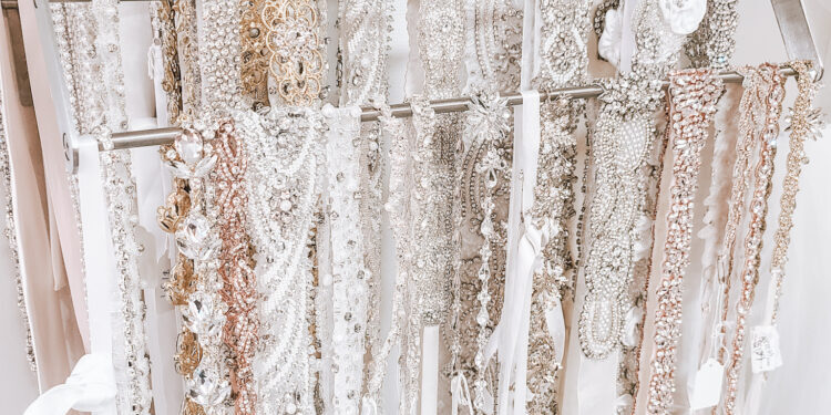 wedding belts and sashes on a rack in orange county area bridal boutique