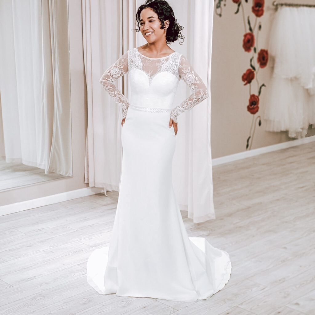 bride wearing long sleeve lace and chiffon fitted wedding dress los angeles california