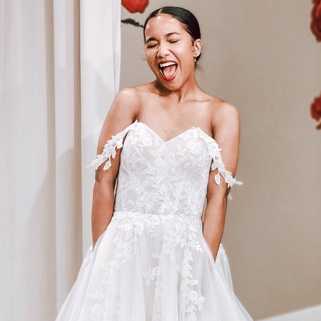 bride wearing lace and tulle wedding dress with pockets whittier california