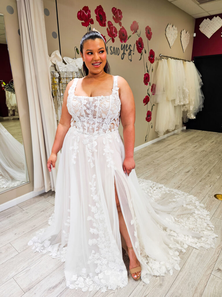 plus size bride wearing floral aline wedding dress in whittier california bridal shop