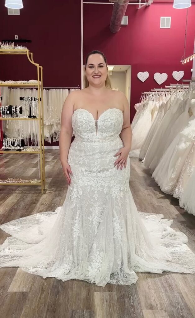 plus size bride wearing sparkly beaded mermaid wedding dress in hayward california bridal shop