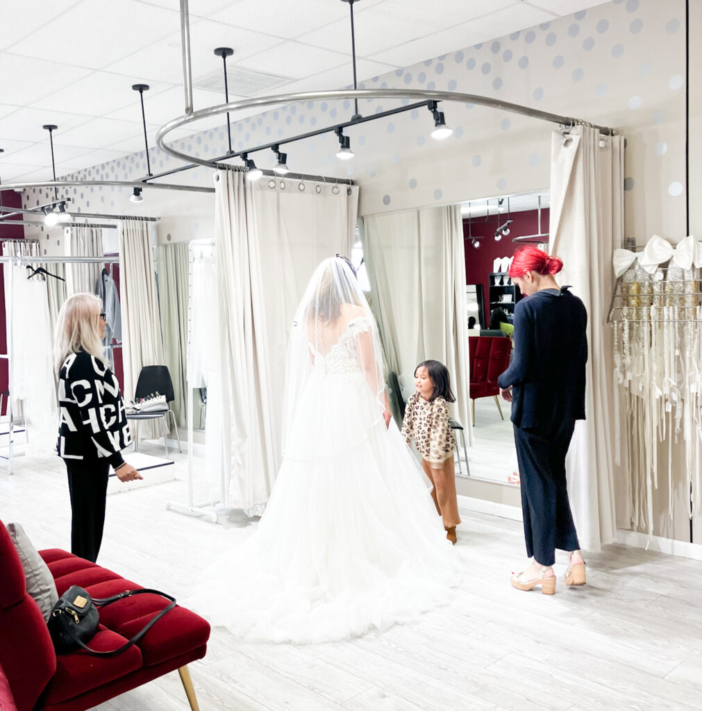 bride trying on wedding dress in whittier california bridal shop