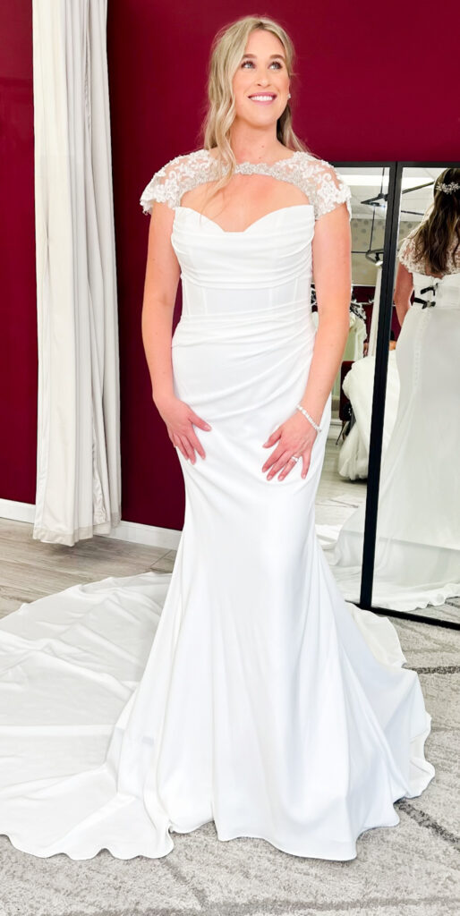 classic crepe wedding dress with lace sleeves added at whittier california bridal shop