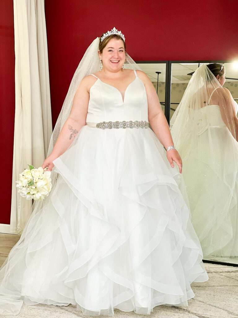 plus size wedding dress with beaded belt and layers in skirt