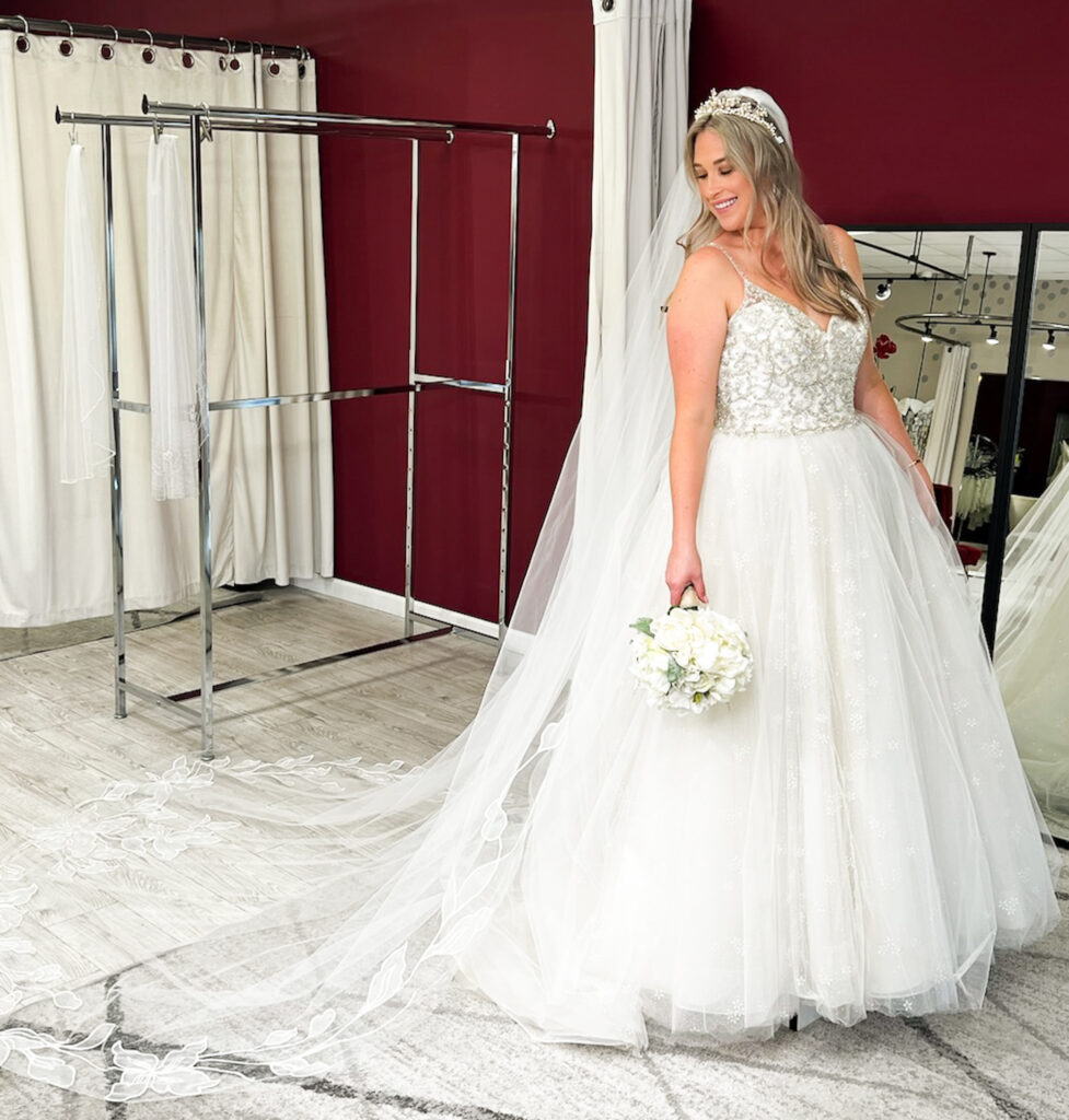 woman wearing fluffy ballgown wedding dress in whittier california bridal store