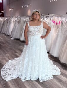 plus size bride wearing gorgeous garden wedding dress in oakland california bridal store