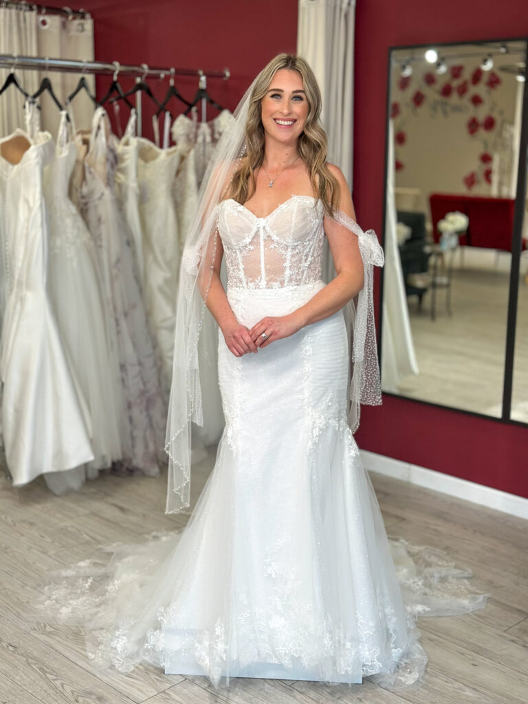 mid size curvy bride wearing gorgeous garden wedding dress in oakland california bridal store